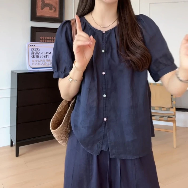 2025夏季休闲时尚百搭舒适甜美圆领珠扣短袖衬衫LK2503177
