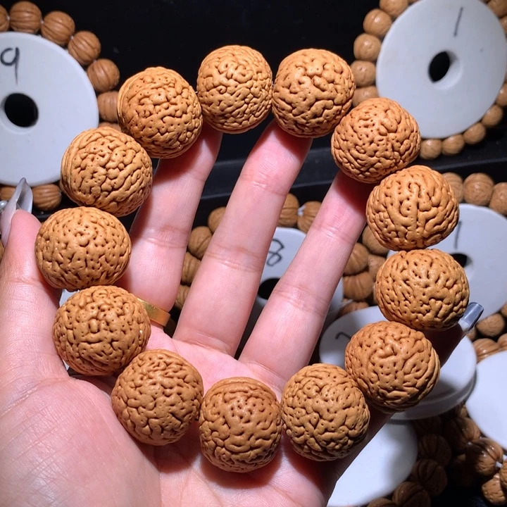 去***能桃核手串野生大地雷