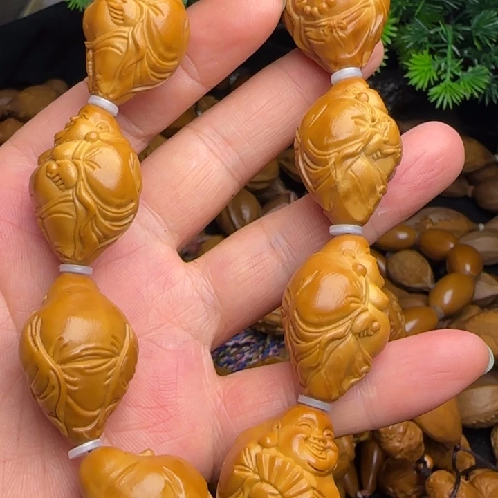 半***醒橄榄核雕刻手串米勒