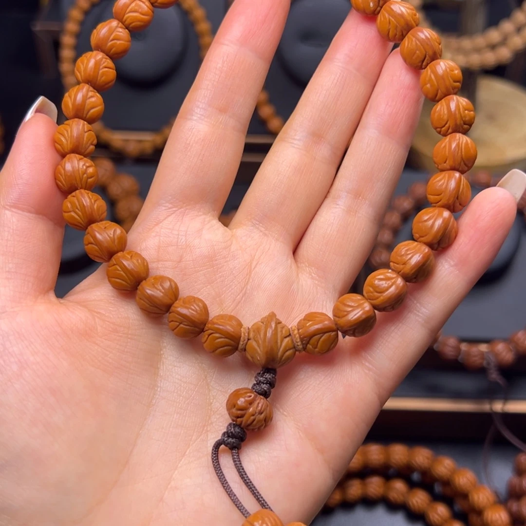 魏***少手串桃核野生玉龙脊10