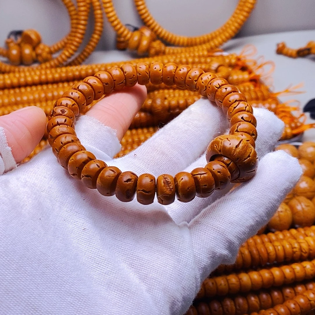 桃核吊坠6乘10核片手串微瑕40