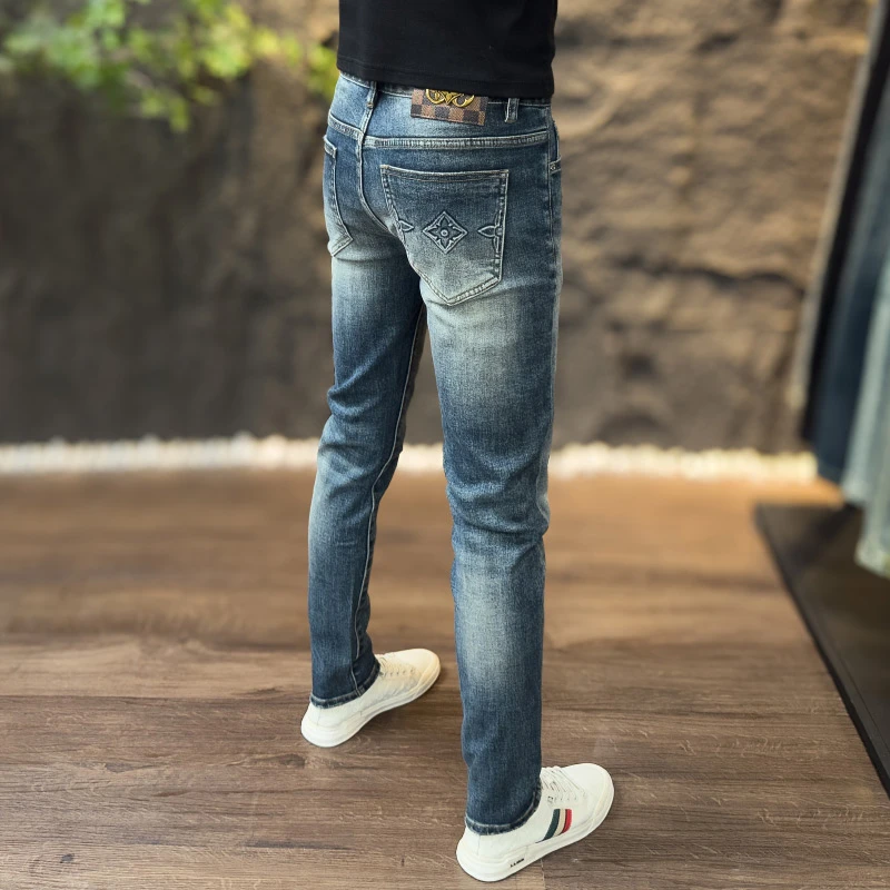 秋冬款潮流牛仔裤欧货男士印花复古重水洗磨边修身弹力小脚长裤子