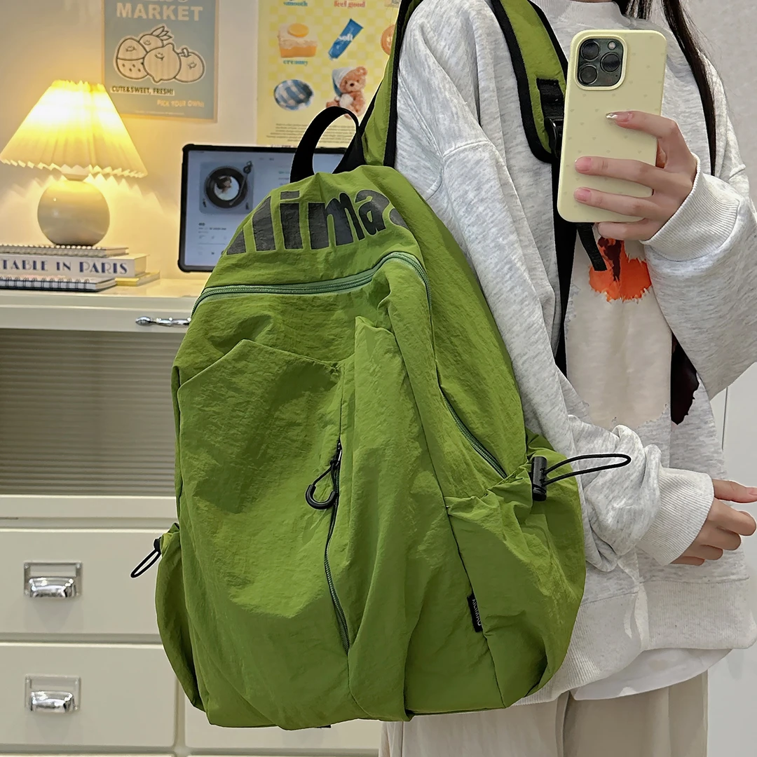 双肩包女旅游轻便2025新款旅行背包高颜值休闲登山包男生出游书包