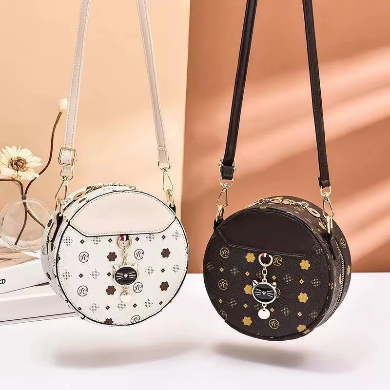 简约风拉链单肩韩版休闲斜挎斜挎包春夏圆形网红潮流印花零钱包