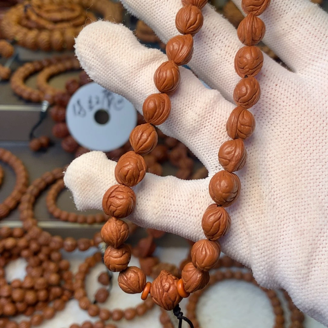 尔***东手串桃核秦岭龙纹