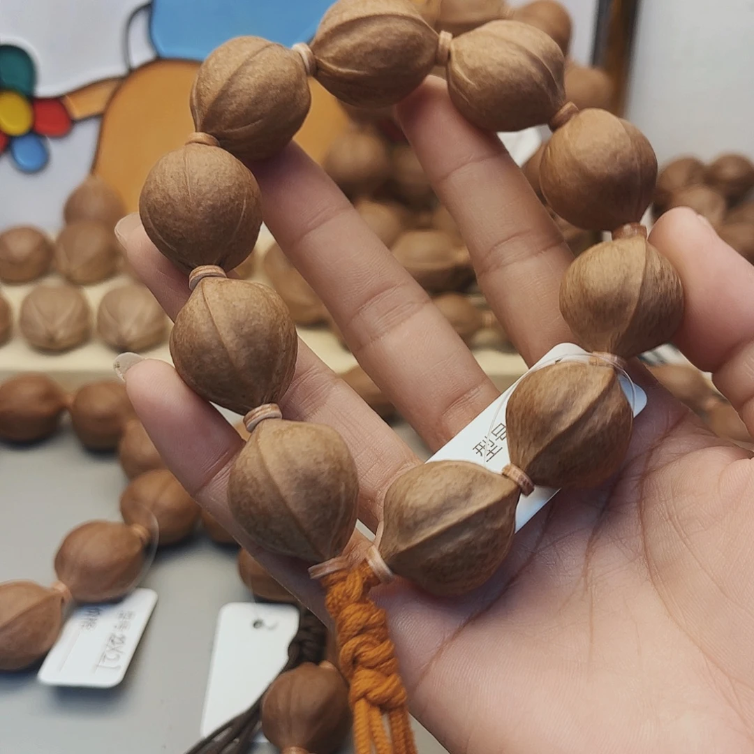 星***海手串橄榄核梅林铁核20 。25原皮白霜红肉