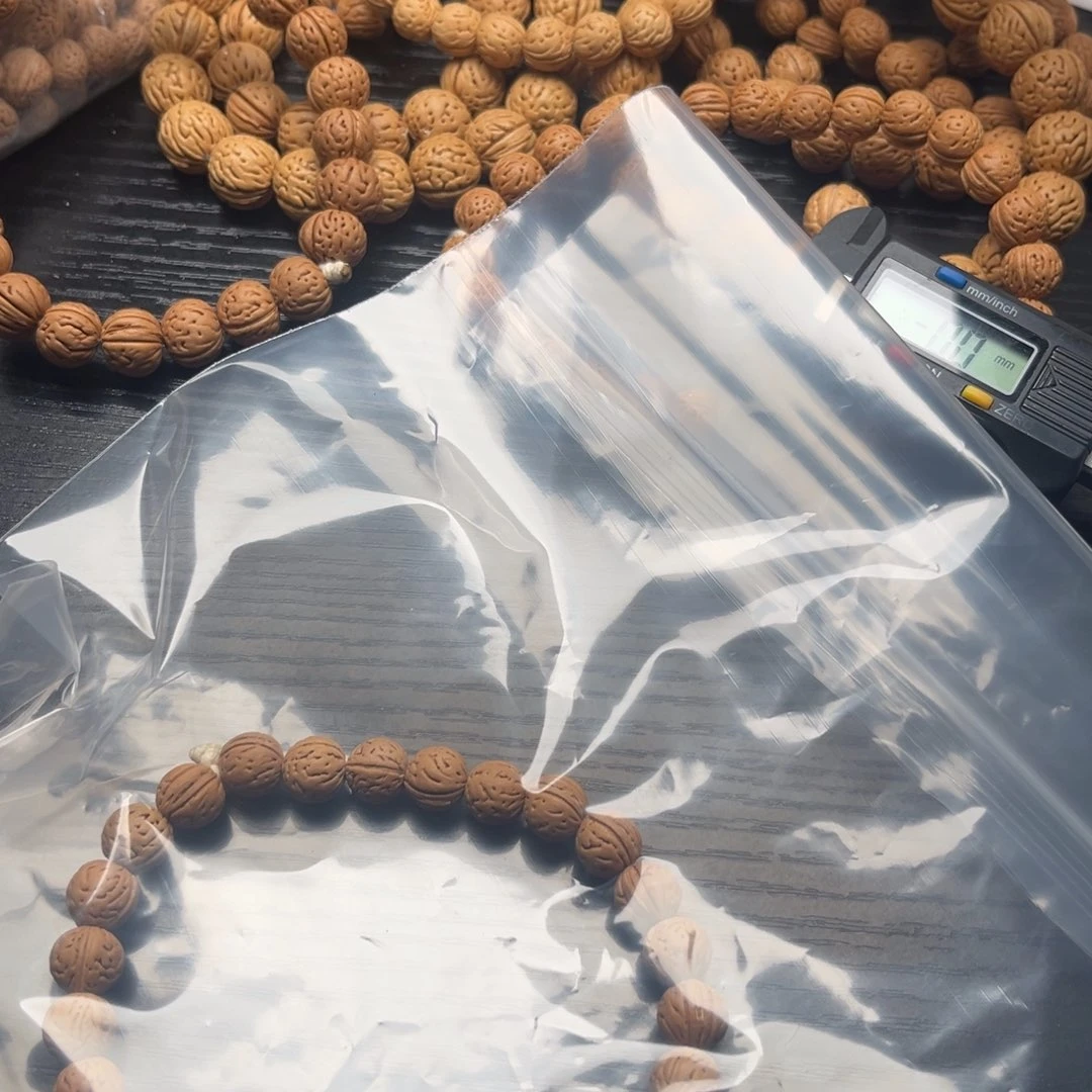 了***痕文玩核桃吊坠小桃核手串必须玩红