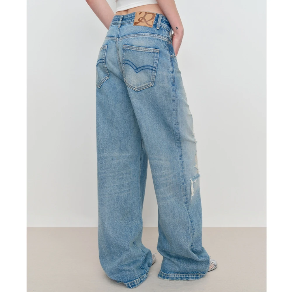 复古浅蓝色破洞牛仔裤女2025秋季新款斜门襟错位低腰阔腿直筒裤子