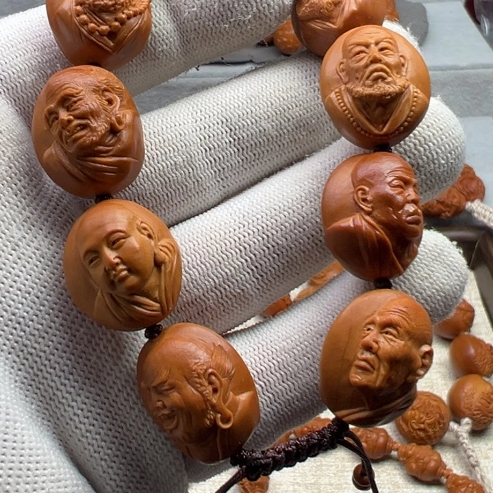 春***乐手串橄榄核橄榄核雕工艺制作