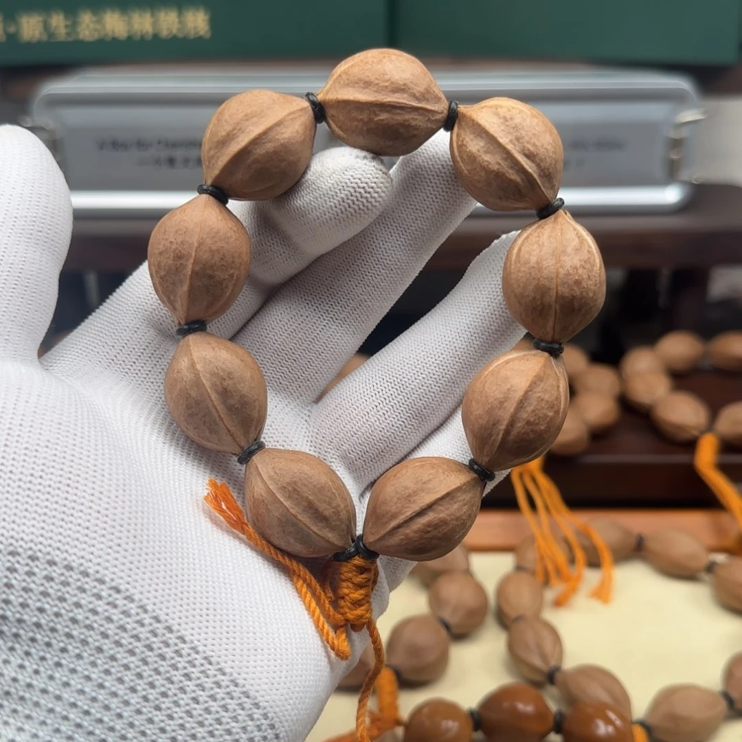 橄榄核手串来***。2028三花大籽