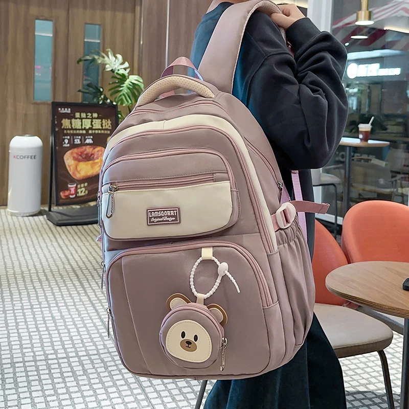 减负护脊超大容量中学生初中生书包女高中生女生小学生双肩背包潮