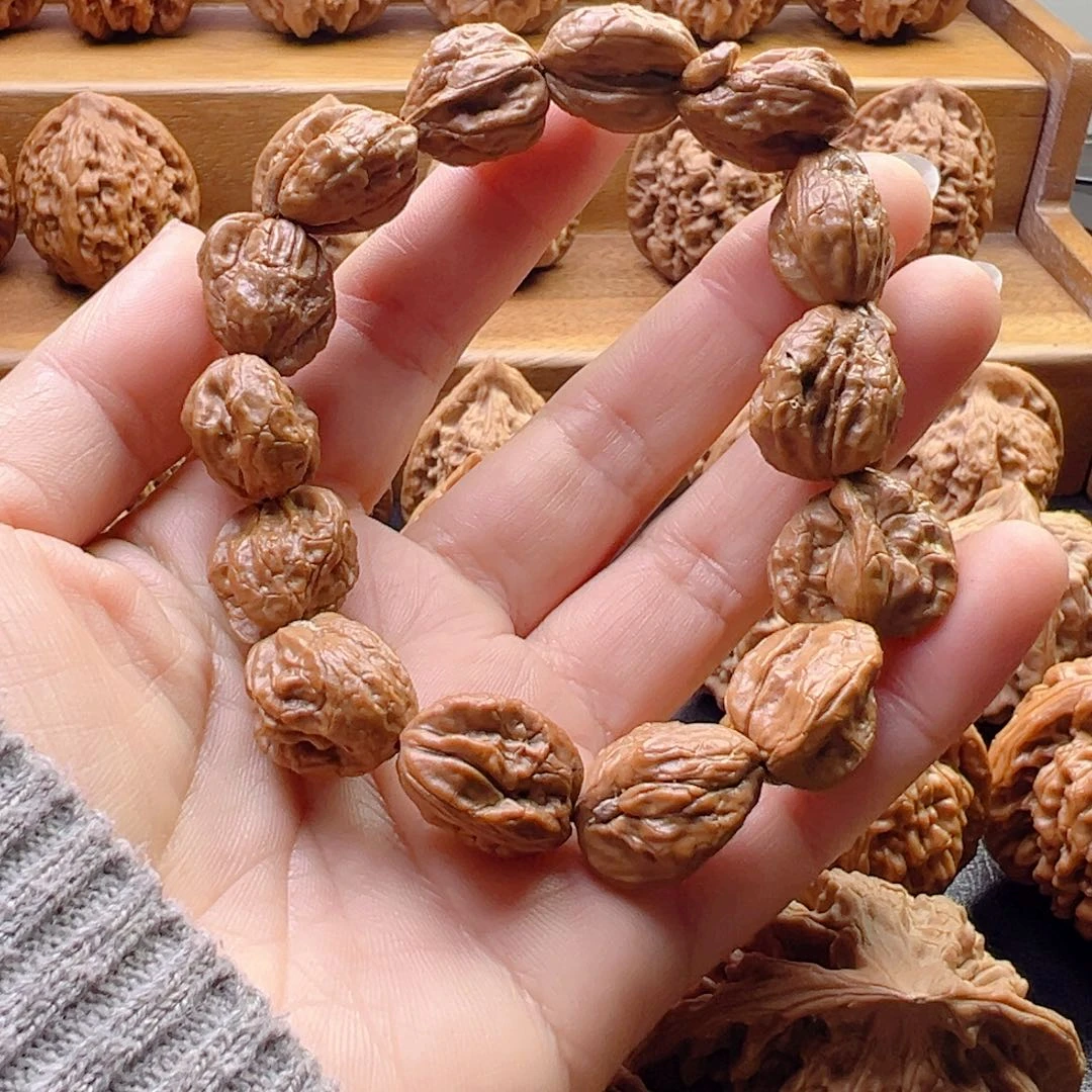 巴***耶核桃野麻手把件特价