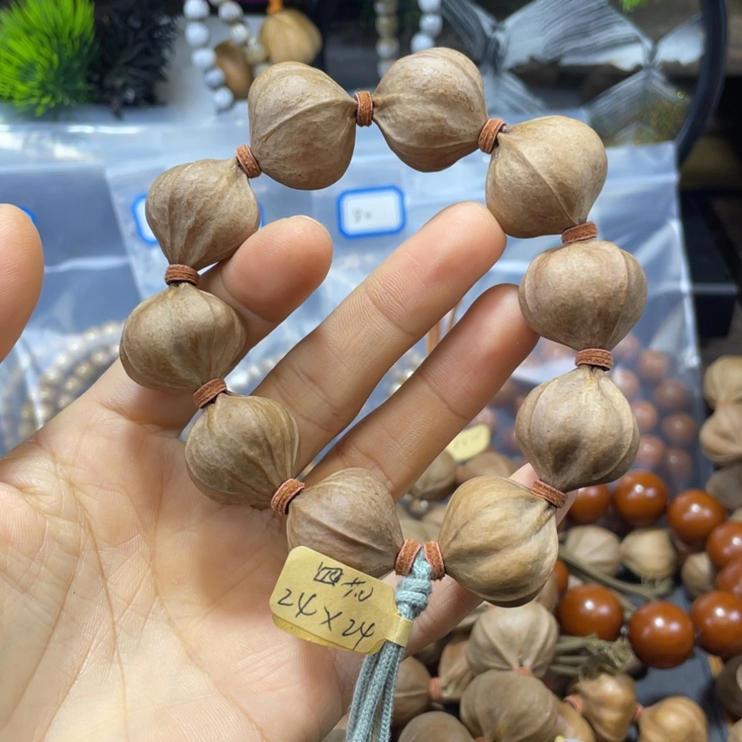 按***难橄榄核吊坠2424四花铁核