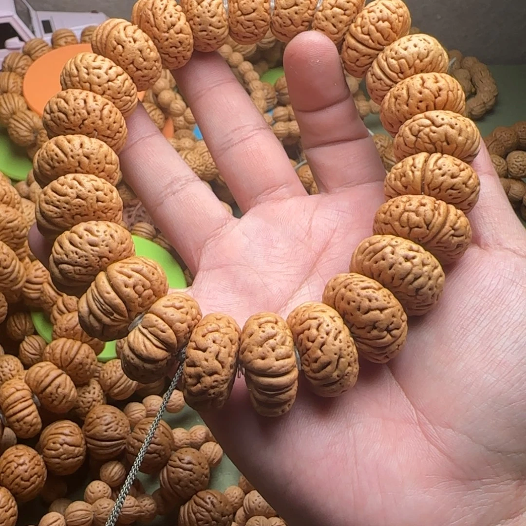 东***曦桃核手串夜明珠桃核夹板手持