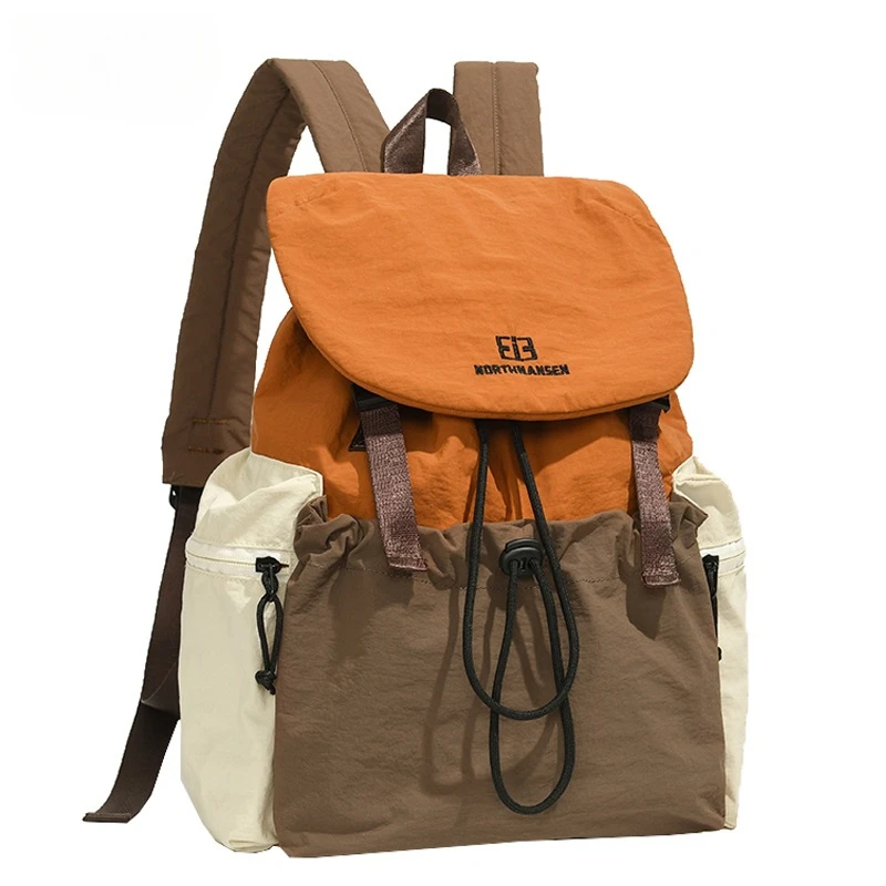 时尚简约轻便学生书包大容量休闲旅行女背包男士撞色双肩包高级感