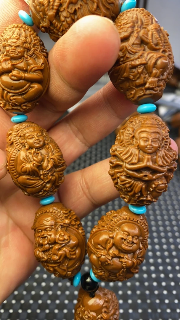 得奖2.3万佛朝宗雕刻手串是黄金树上沉水核不是橄榄核是沉水核