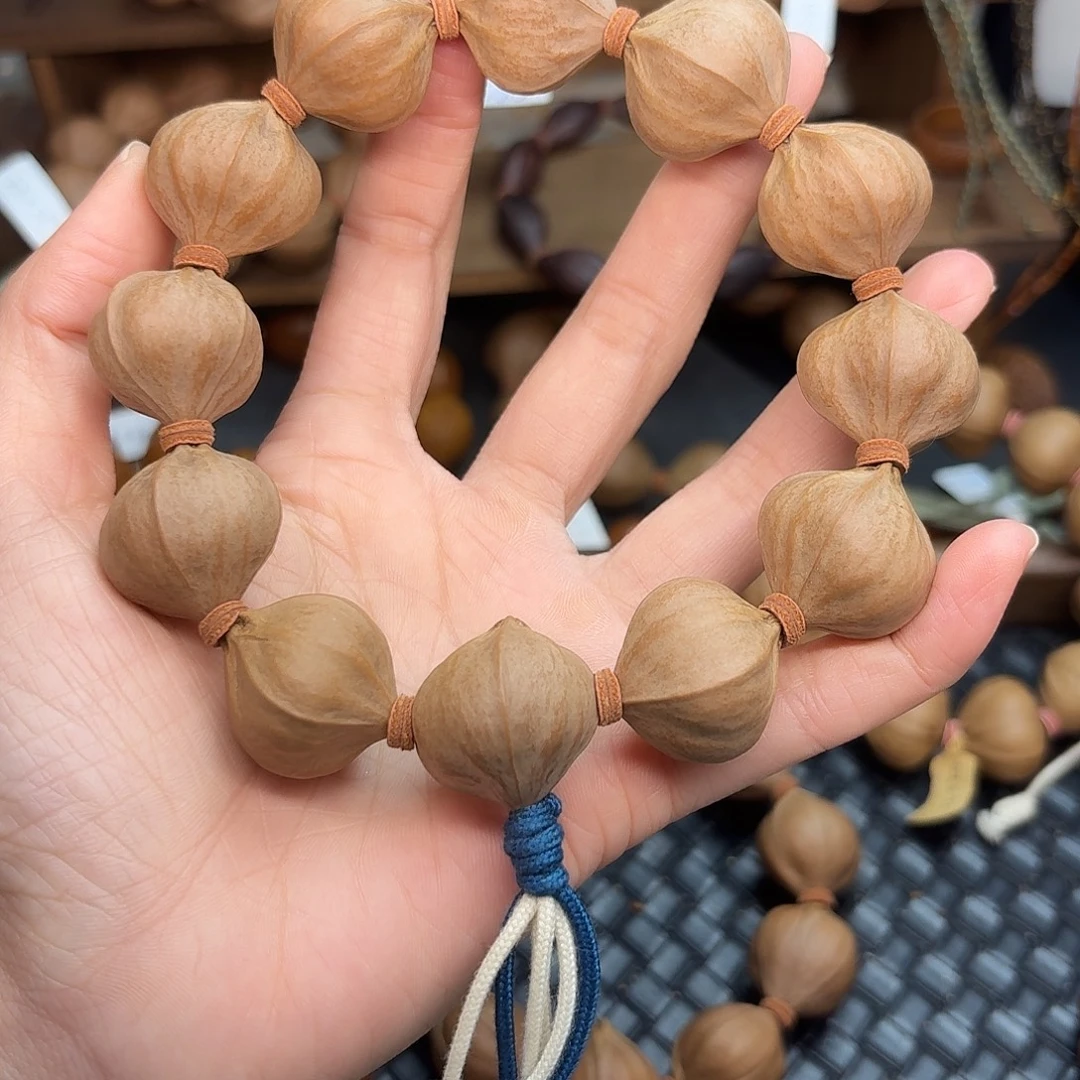 橄榄核手串06。2.35*2.4四花