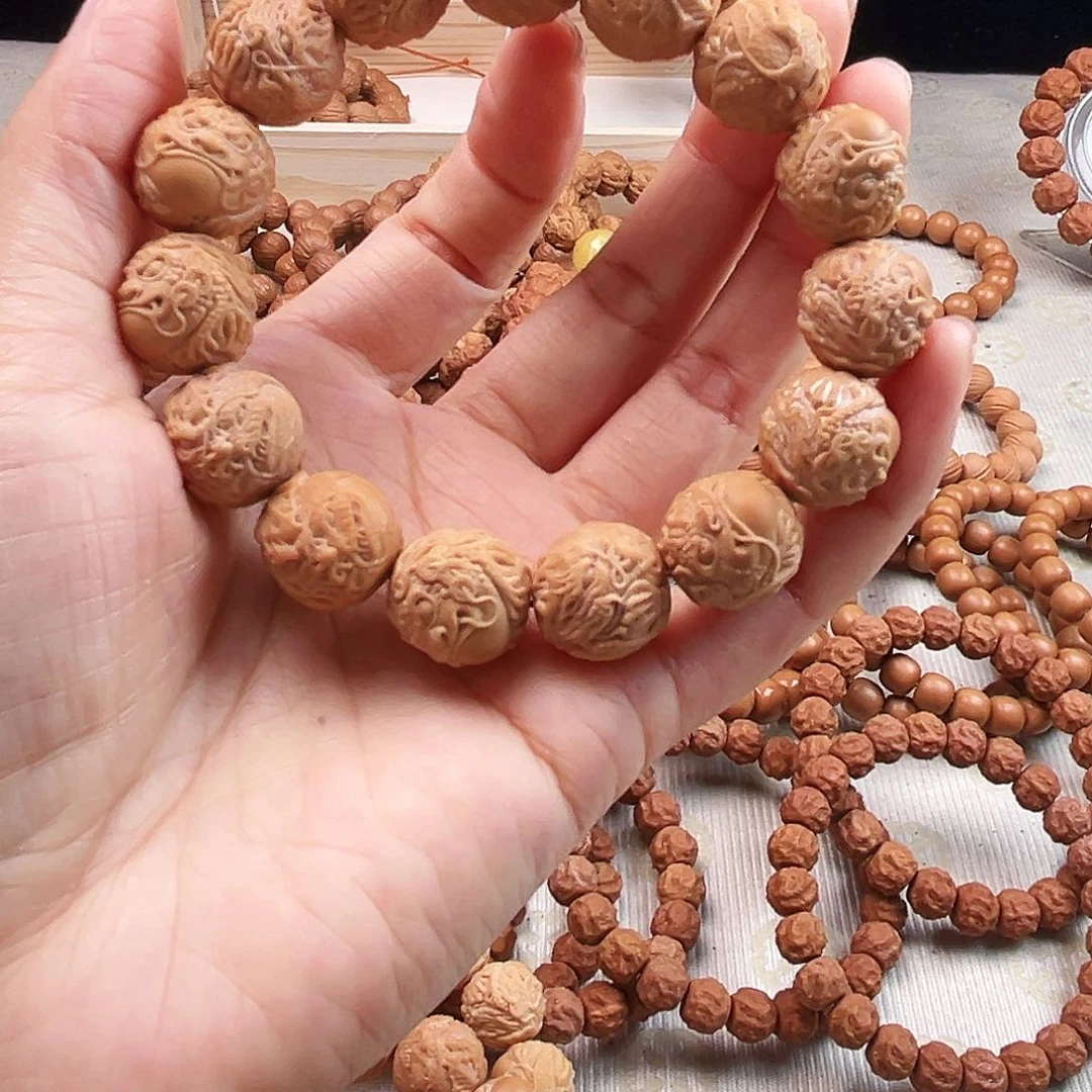 桃核手串瑕疵龙蛇缠（漏眼）