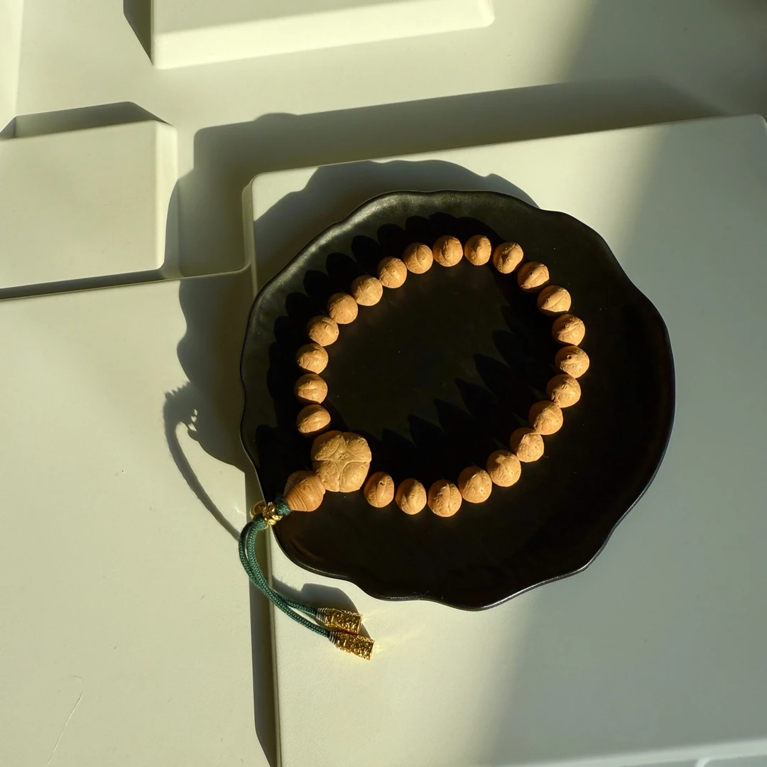 编号T60「金瞳玉豆」10.4-10.6mm21+2备籽尼泊尔凤眼菩提文玩手串