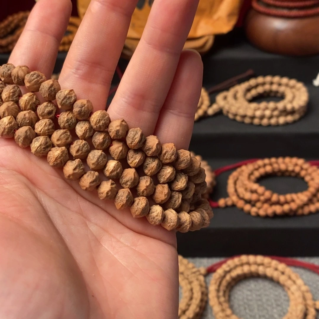 沈***地柏香籽/百香籽吊坠