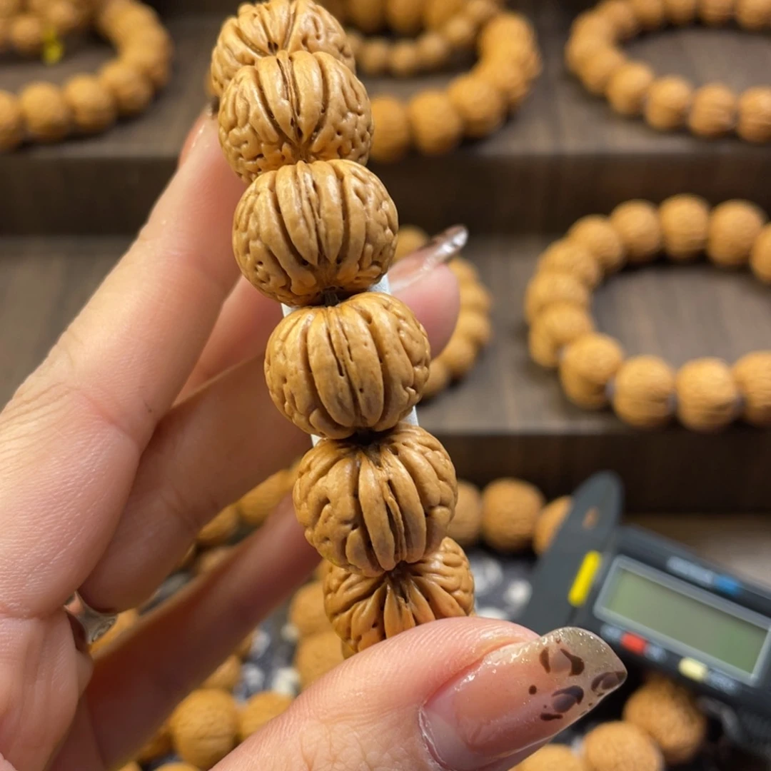 桃核手串小*笼野生金丹