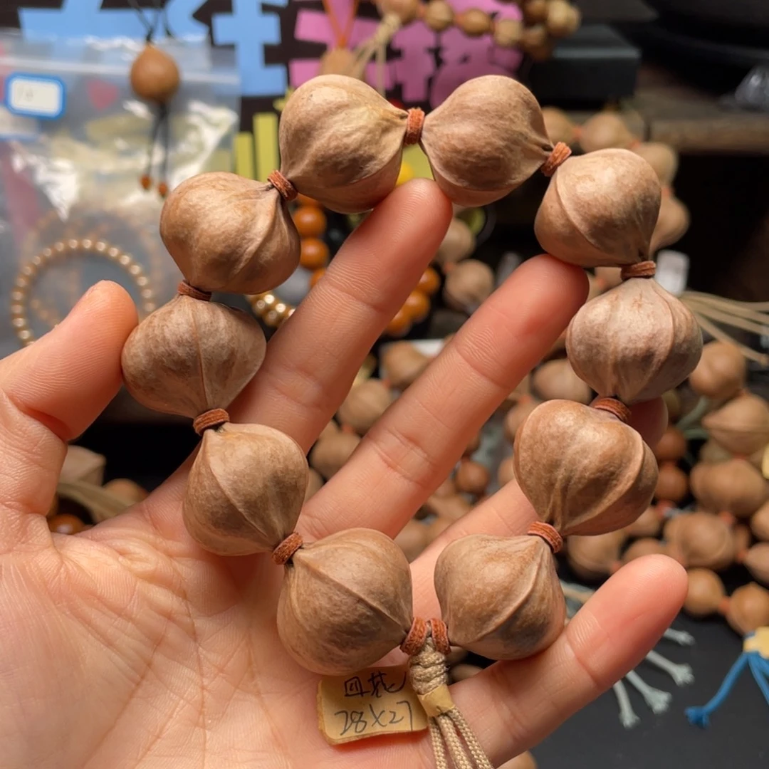 喵***多吊坠橄榄核2827四花铁核