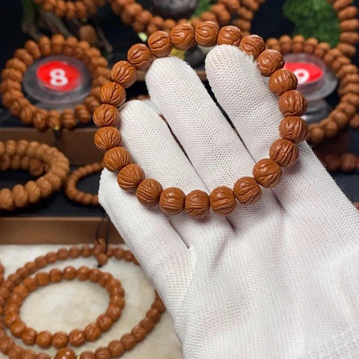 桃核吊坠南*。秦岭龙纹