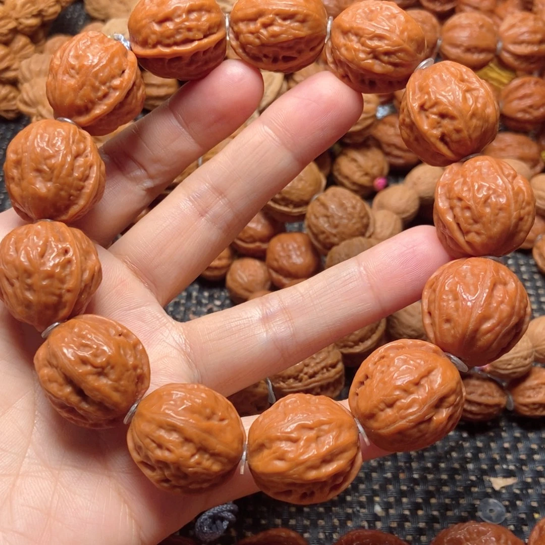 文玩核桃吊坠纽扣手串