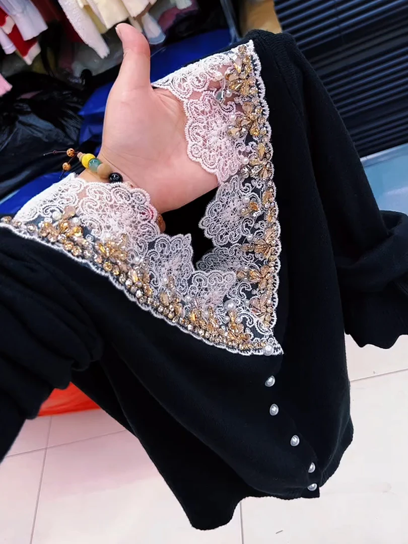 高级感重工钉珠设计感黑色上衣女2025早秋气质修身显瘦长袖针织衫