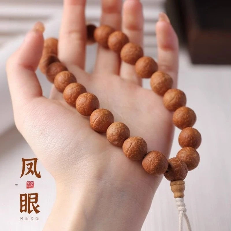 尼泊尔凤眼菩提手串三通流苏菩提手持高密封眼凤眼文玩串佛珠手链