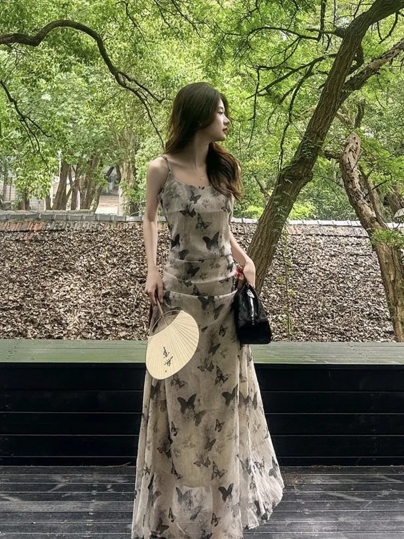 清冷水墨蝴蝶碎花吊带连衣裙女新款法式别致绝美气质长裙子AM8085