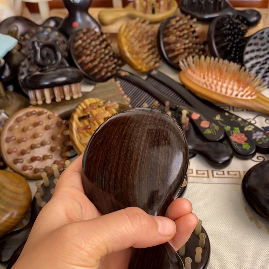 瑕疵紫光檀按摩梳子