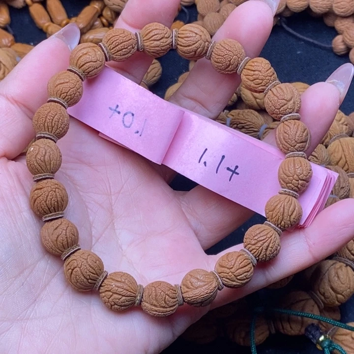 朗***轩秦岭龙纹桃核21颗