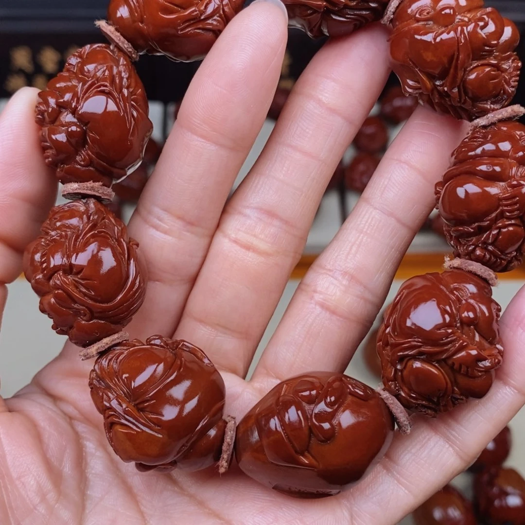 平***淡橄榄核吊坠八宝弥勒