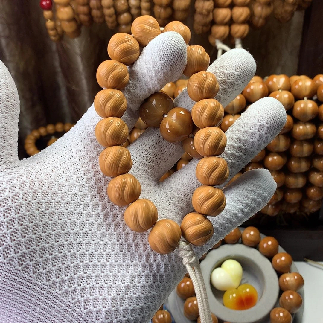 曦***.吊坠桃核卷卷酥手持