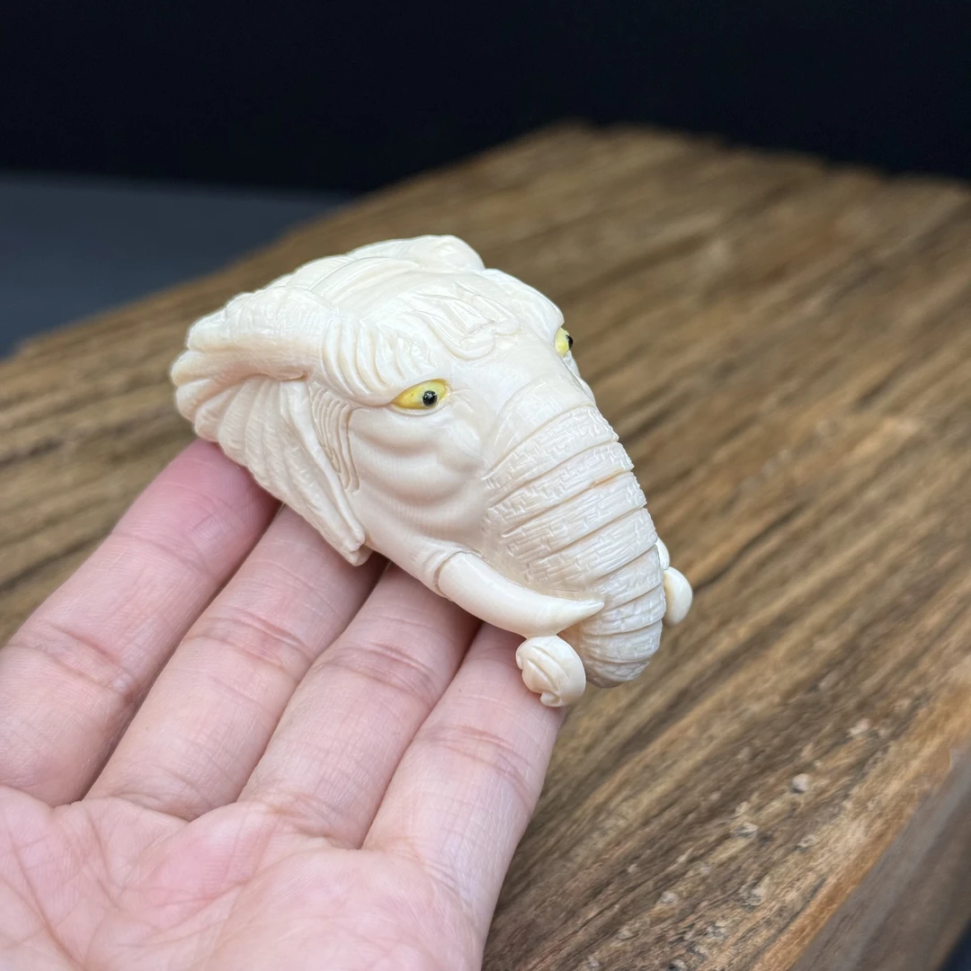 H88-05天然猛犸牙 象神手把件31x65x32mm60.1克支持鉴定 假一罚四