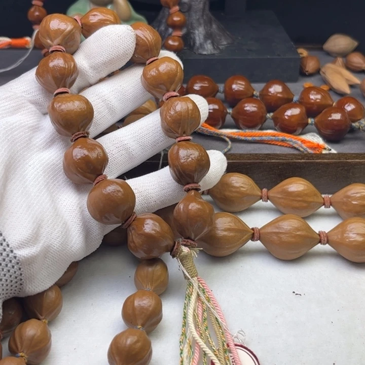 酒***九手串/手链橄榄核1.8*2.0原皮蒜头铁核