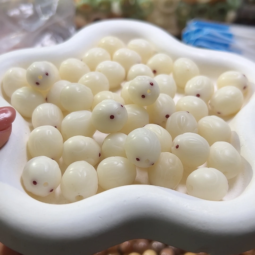 菩提根/象牙果吊坠微瑕15紫眼兔10颗