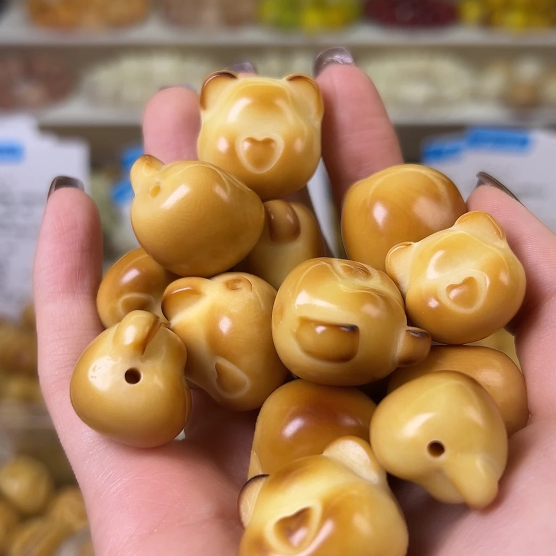 菩提根/象牙果手串瑕疵炭烤熊头10颗配大小