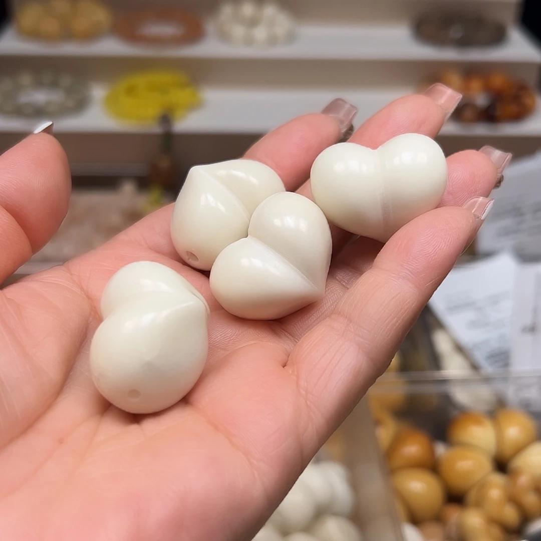 腊***子手串菩提根/象牙果瑕疵白色屁桃10颗