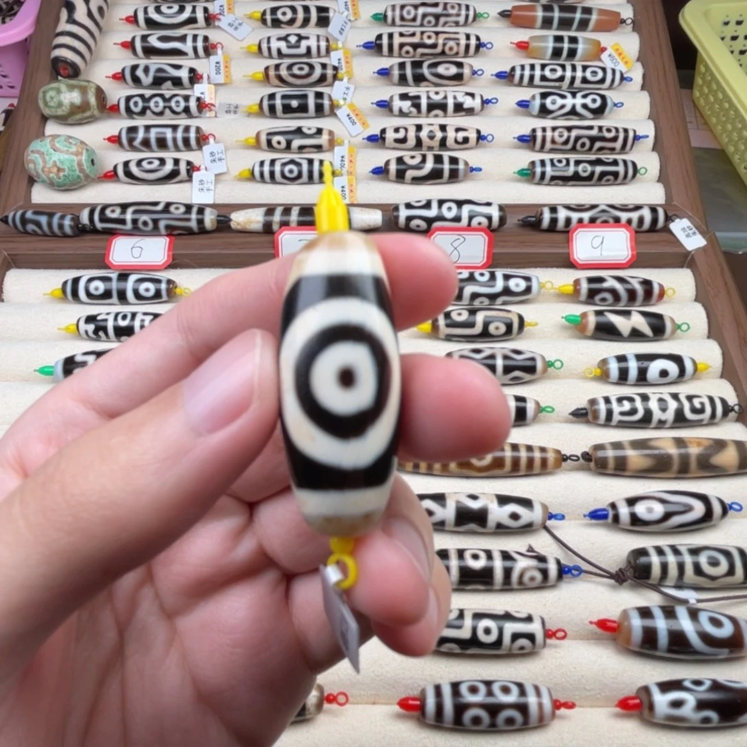 逍***火玛瑙/玉髓裸珠35.5 14.5 行运一眼图腾