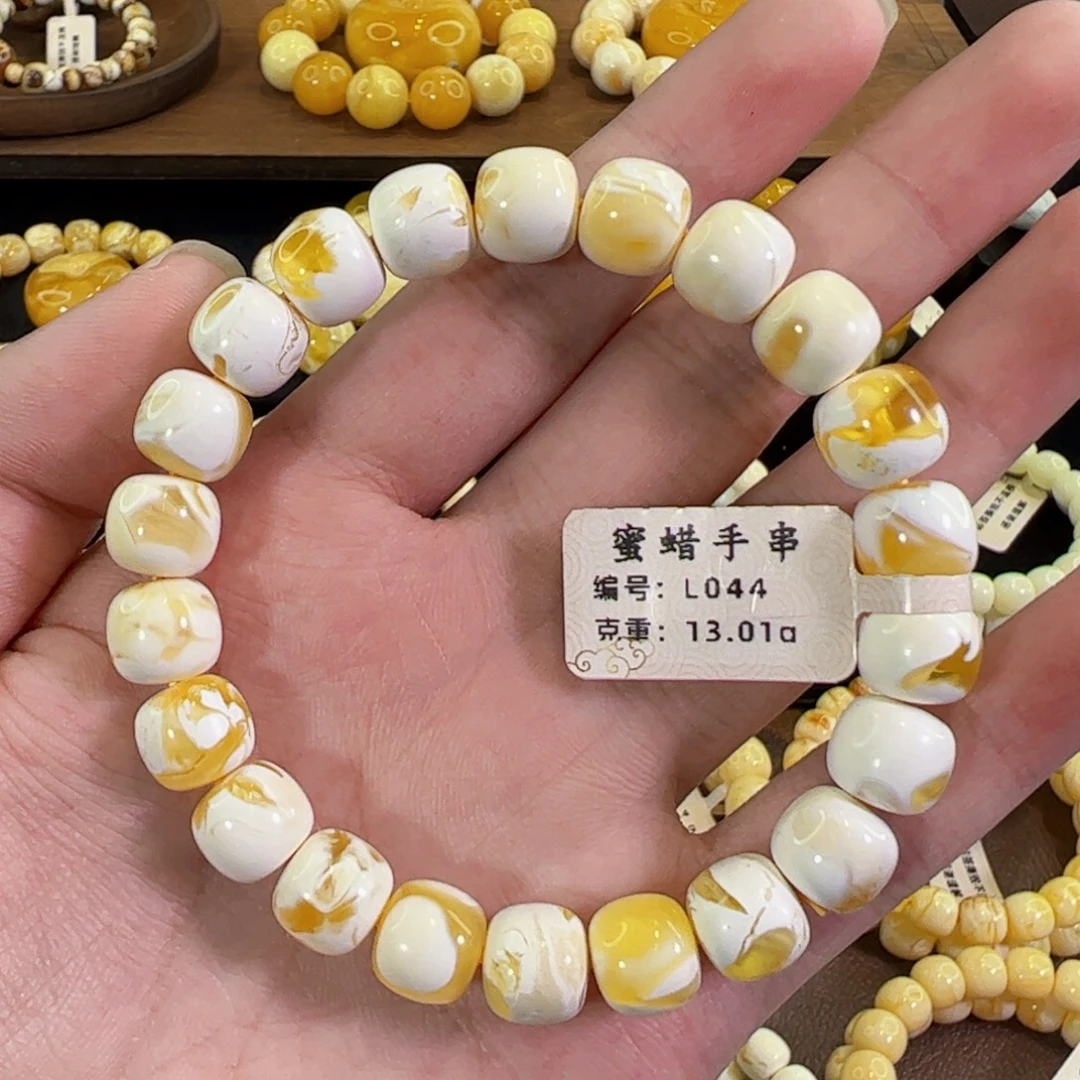 琥珀未镶嵌裸石10mm金漆白溶洞老型手串