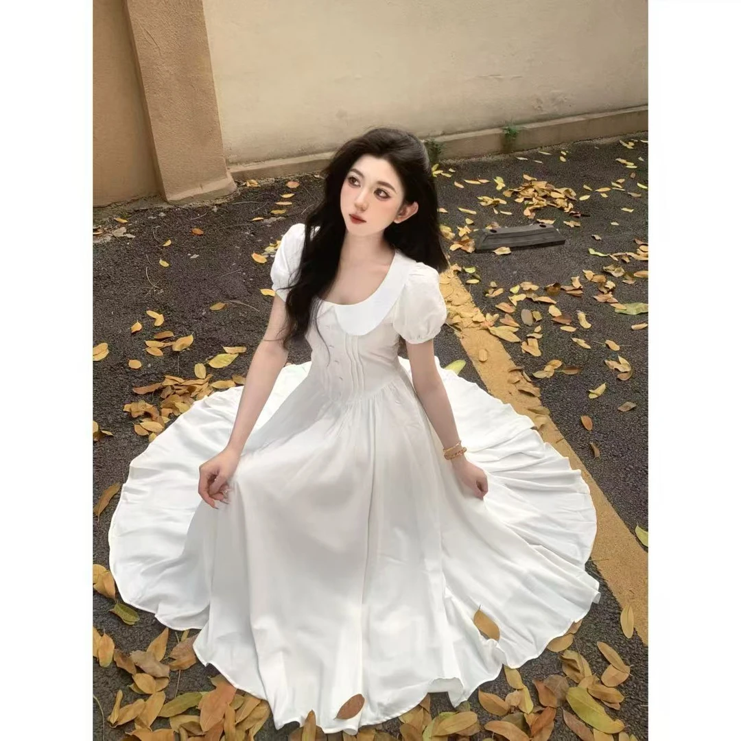 娃娃领白色气质温柔收腰连衣裙女夏季新款短袖度假文艺风长裙子
