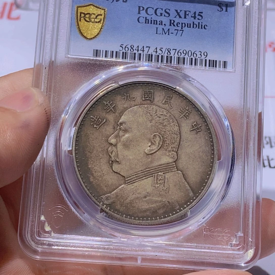 银梦***把国福90639九精银币一枚