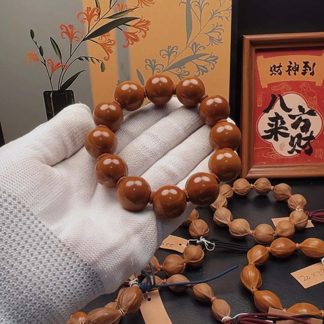 佳***彭手串橄榄核17光珠