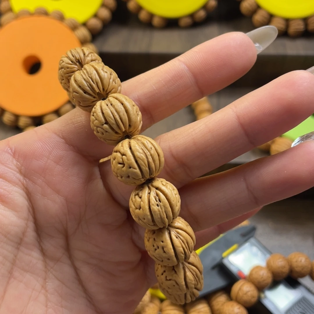 桃核手串陳**、野生金丹