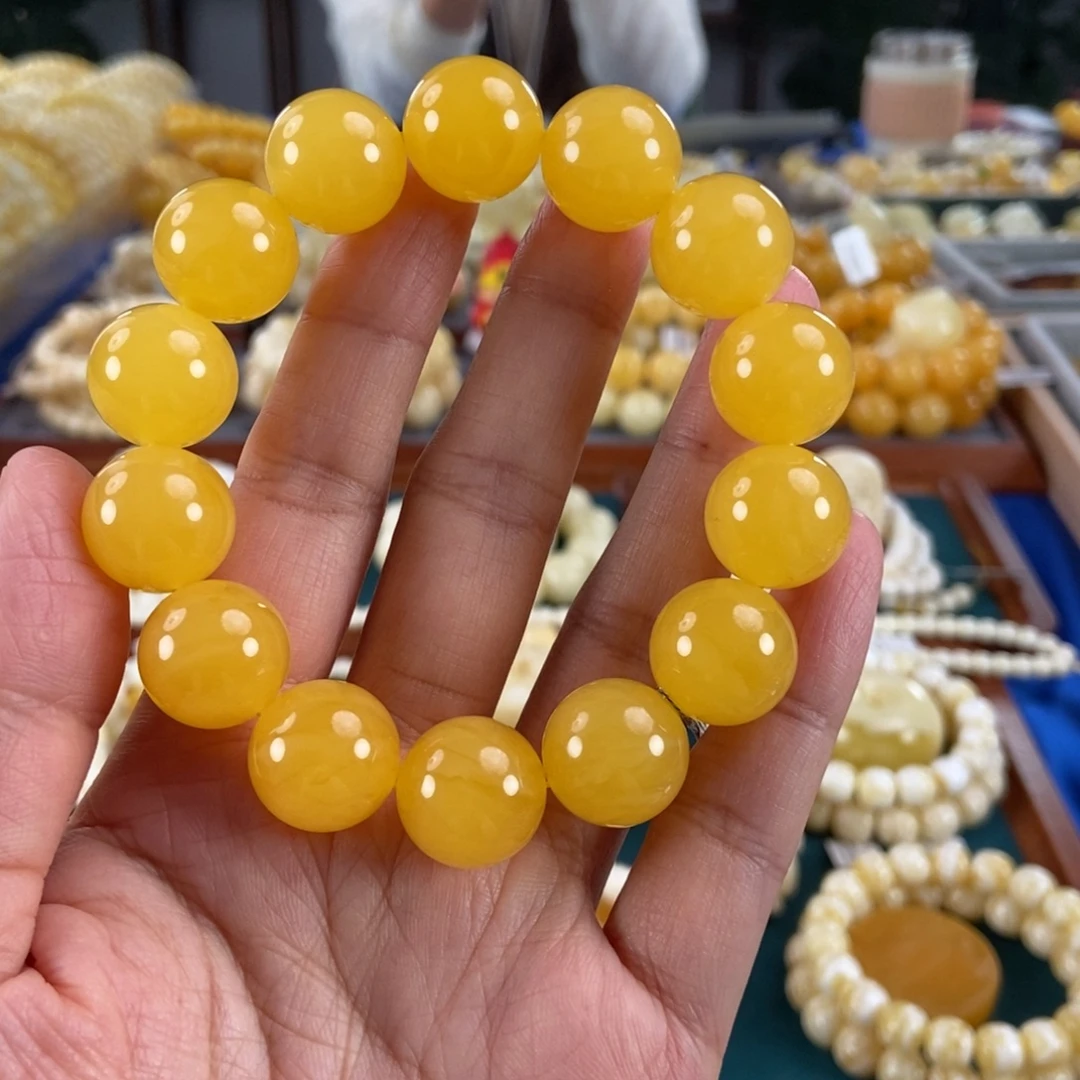 琥珀未镶嵌珠宝奇石16同料鸡油红圆珠31.44