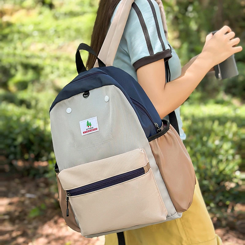 2025跨境校园撞色防书旅通勤时尚百搭肩减压轻背