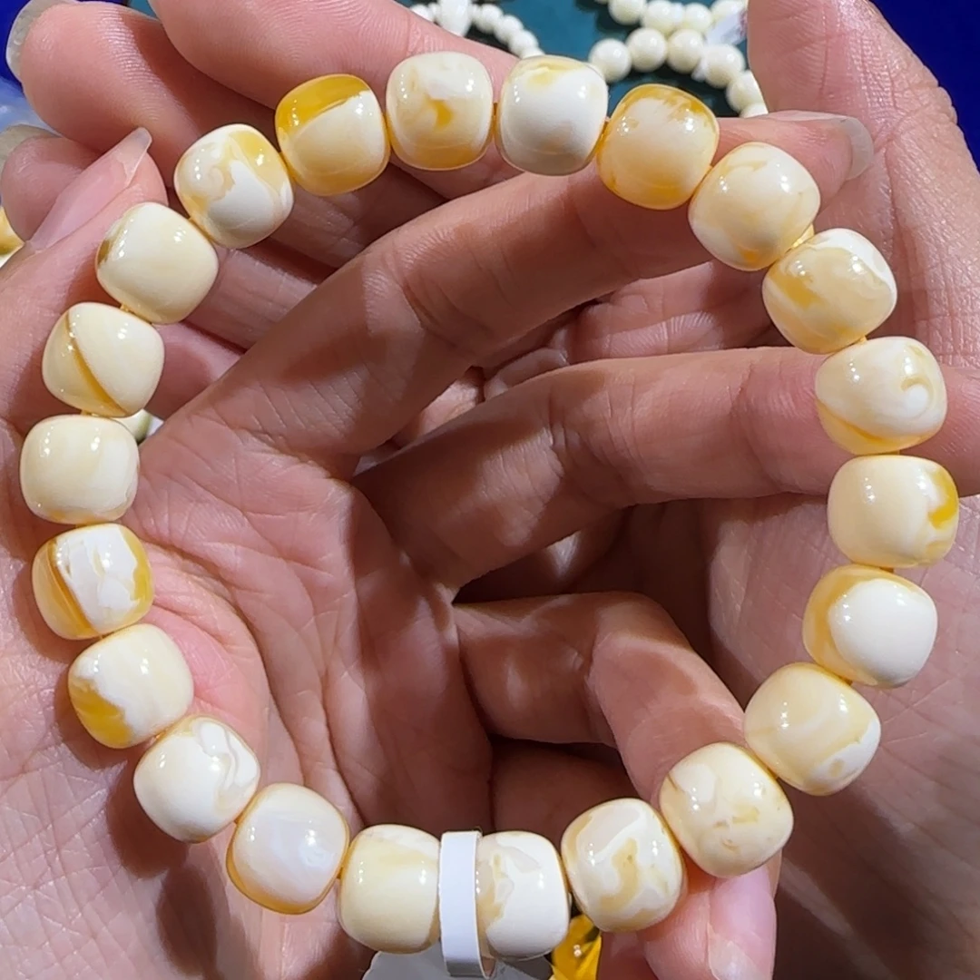 琥珀未镶嵌裸石10.5mm橘粉溶洞手串