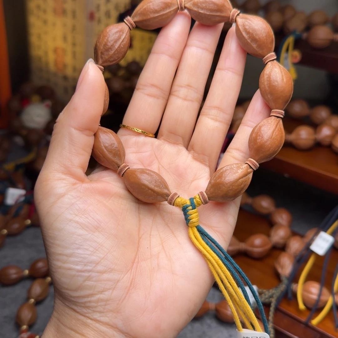 倩***说橄榄核手串16/27小尺寸老核原皮 梅林铁核